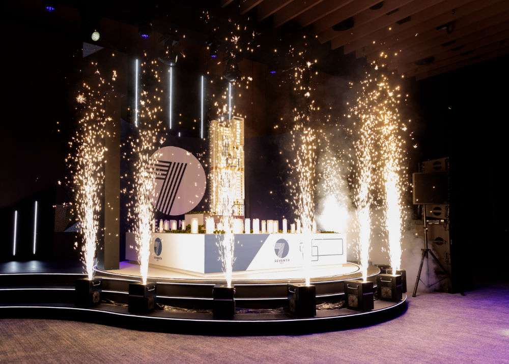 Stage with fireworks and decorative lighting for a vibrant event celebration.