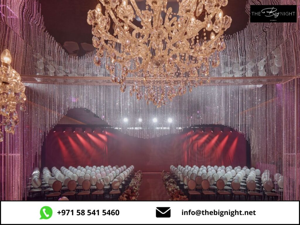 Luxurious event venue with elegant chandeliers and seating arrangement, ready for a special occasion.