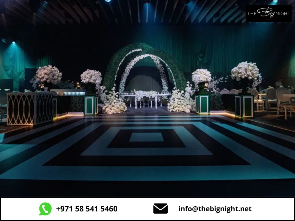 Elegant event venue with floral decorations and ambient lighting for a sophisticated evening gathering.